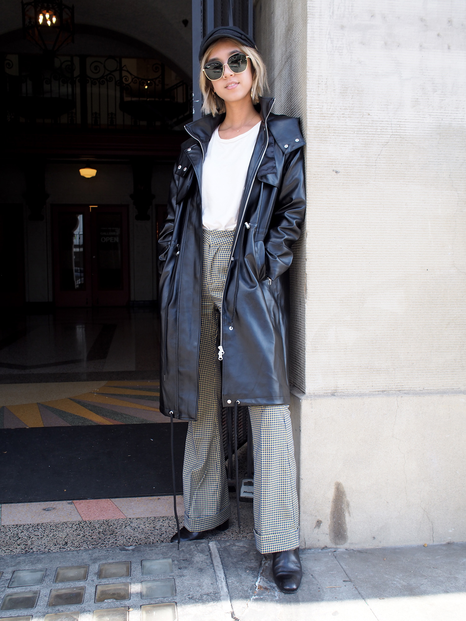 Plaid Trousers & Black Trench Raincoat