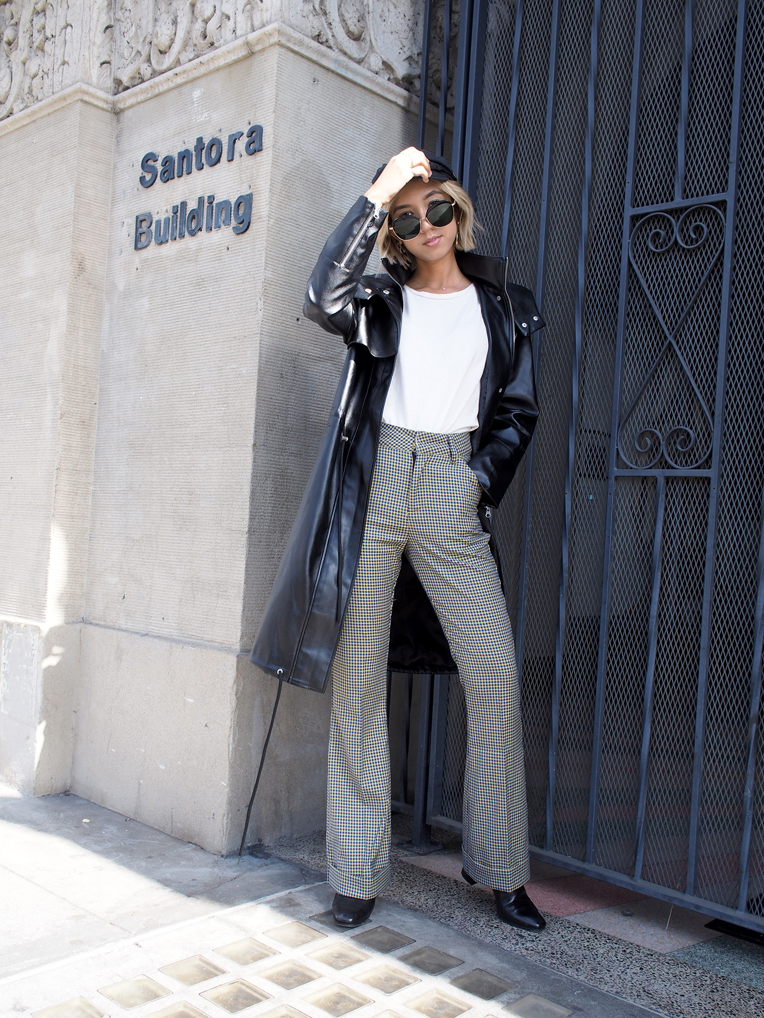 Plaid Trousers & Black Trench Raincoat